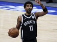 Nets guard Kyrie Irving reacts during the third quarter against the Mavericks at American Airlines Center in Dallas, May 6, 2021.