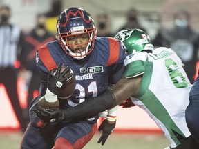 Saskatchewan Roughriders defensive end A.C. Leonard (6) tackles Montreal Alouettes running back William Stanback on Saturday.