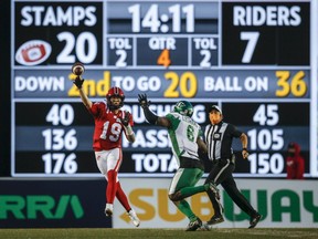 Calgary Stampeders quarterback Bo Levi Mitchell, shown being pursued by A.C. Leonard on Saturday, staked his team to an early 14-0 lead on Saturday at McMahon Stadium.