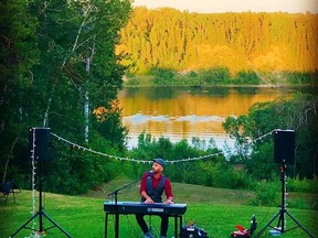 Jeffery Straker performs at a private backyard concert this summer in Nipawin, with the Saskatchewan River in the background.