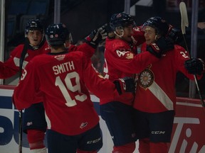 Regina Pats' Sloan Stanick, right, celebrates his first of two goals on Saturday at the Brandt Centre.