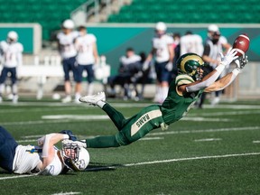 D'Sean Mimbs of the University of Regina Rams stretches for a pass against the UBC Thunderbirds on Saturday at Mosaic Stadium.