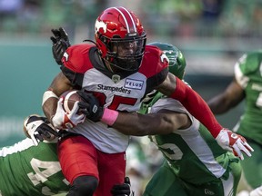Stopping running back Ka'Deem Carey (35) is a key to the Saskatchewan Roughriders beating the host Calgary Stampeders on Saturday.