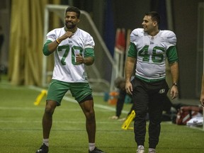 Saskatchewan Roughriders punter Kaare Vedvik (70) laughs with long snapper Jorgen Hus (46) during a recent practice with the Green and White.