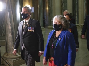 Lieutenant Governor of Saskatchewan Russ Mirasty, left, and his partner Donna Mirasty, right, enter the chamber on first day of the legislative session at the Legislative Building in Regina on Wednesday Oct. 27, 2021.