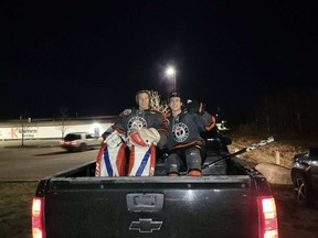 Yorkton Terriers goalie Bradley Mistol, left, and defenceman Tyson Perkins in the back of a truck outside Kinsmen Arena on Oct. 19, when the Terriers faced the visiting Weyburn Red Wings. The game was moved from Westland Arena after the first period due to poor ice conditions. Photo by Jordan Stene.