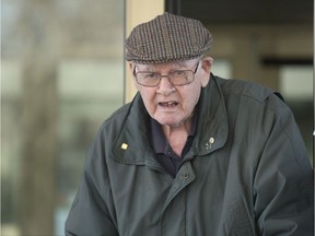Father Robert Mackenzie, appearing for an appeal of an extradition order back to Scotland leaves court in Regina on Dec. 4, 2019.