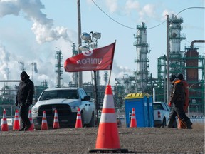 Unifor pickets walk the line at Gate 7 in front of the Co-op Refinery Complex on Fleet Street on Feb. 18, 2020.