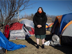 Camp Marjorie volunteer Alysia Johnson stands for a photo at the tent encampment for homeless people at Pepsi Park in Regina, Saskatchewan on Nov. 3, 2021.