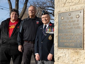 From left to right, filmmaker Tony Towstego with Brian Swidrovich and veteran Reg Harrison at Woodlawn Cemetery in Saskatoon on Nov. 9, 2021. (Saskatoon StarPhoenix / Michelle Berg)