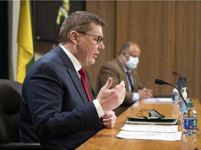 Premier Scott Moe and Chief Medical Health Officer Dr. Saqib Shahab at Thursday's press conference.