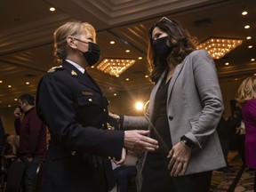 Chief Superintendent Sylvie Bourassa-Muise, left, Commanding Officer, RCMP Depot Division, speaks with Mayor Sandra Masters prior to Masters delivering the 2021 State of the City Address on Tuesday, November 30, 2021.