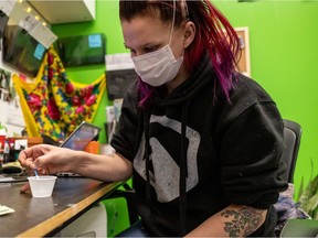 Elizabeth Plishka, director of support services at Prairie Harm Reduction, demonstrates the use of a fentanyl test strip in Saskatoon on Nov. 30, 2021.