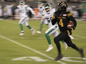 The Hamilton Tiger-Cats' Papi White takes off on a 46-yard punt return against the Saskatchewan Roughriders on Saturday at Tim Hortons Field.