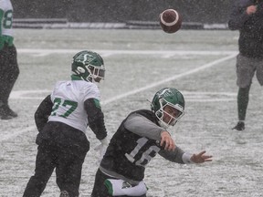 Saskatchewan Roughriders quarterback Isaac Harker (16) throws the ball during a snowy practice at Mosaic Stadium on Tuesday.