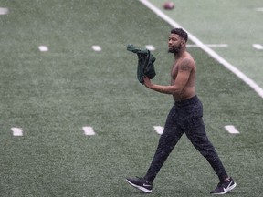 Saskatchewan Roughriders defensive back Loucheiz Purifoy braves the elements and walks around shirtless during practice at Mosaic Stadium on Tuesday.
