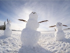Three snow creatures stand together near the Italian Club on Jan. 11, 2021.