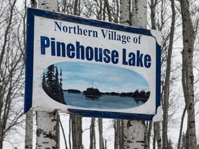 Signs along the road into Pinehouse, Sask.