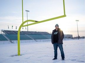 The Saskatchewan Roughriders' Evan Johnson stands on the home field of his former university team, the Saskatchewan Huskies, on Dec. 17, 2021, in Saskatoon.