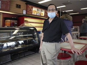 Vuong Pham, owner of Country Corner Donuts, inside his store on Monday, December 6, 2021.