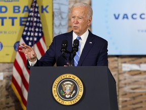 U.S. President Joe Biden gestures as he delivers remarks on the importance of COVID-19 vaccine requirements, during a visit at a Clayco construction site, in Elk Grove Village, Ill., Oct. 7, 2021.