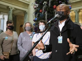 Bashir Jalloh, president of CUPE 5430, speaks while other hospital workers look on during a press conference at the Legislative Building. The health workers spoke about the need for increased full-time positions.