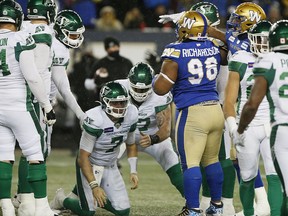 Saskatchewan Roughriders quarterback Cody Fajardo, 7, gets up after being sacked by the  Winnipeg Blue Bombers in Sunday's West Division final. Pass protection was an issue for the Riders' offensive line throughout the 2021 season.