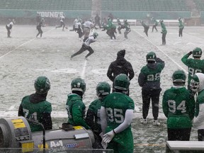 The Saskatchewan Roughriders, shown practising in the snow Nov. 16 at Mosaic Stadium, will likely have to deal with wintry conditions during Sunday's West Division final against the host Winnipeg Blue Bombers.