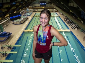 Regina's Lila Stewart, 13, is shown at the Lawson Aquatic Centre with the three medals she won at the 2021 Pan-American junior diving championships.