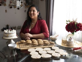 Jodi Robson of Regina poses with some baked items at her home. Robson is a participant in this year's Great Canadian Baking Show holiday special on CBC Gem.