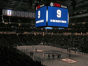 ELMONT, NY - JANUARY 22: Fans stand for a moment of silence to honor former New York Islanders captain Clark Gillies,  prior to the game against the Toronto Maple Leafs at UBS Arena on January 22, 2022 in Elmont, New York.  Gillies who passed away on January 21 served as captain of the Islanders from 1977 to 1979, and won the Stanley Cup four years in a row with them.