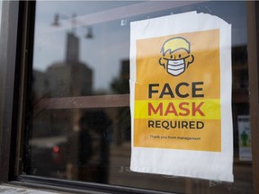 A face mask required sign is taped to a window of a downtown business in Saskatoon. Photo taken in Saskatoon on Thursday, September 9, 2021.