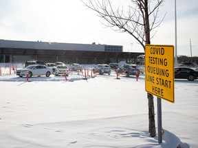 Vehicles line up at a Saskatchewan Health Authority COVID-19 testing site at the former Costco location off University Park Drive on Tuesday, December 28, 2021 in Regina. KAYLE NEIS / Regina Leader-Post