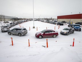 The lineup to for the drive-thru COVID-19 testing at the old Costco building extended well beyond the parking lot and spilling all the way back along Victoria Avenue on Tuesday, January 4, 2022 in Regina. TROY FLEECE / Regina Leader-Post