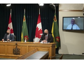 Education Minister Dustin Duncan, from left, Marlo Pritchard, president Saskatchewan Public Safety Agency and Saskatchewan's Chief Medical Health Officer Dr. Saquib Shaha provide a COVID-19 update on Wednesday, January 5, 2022 in Regina.