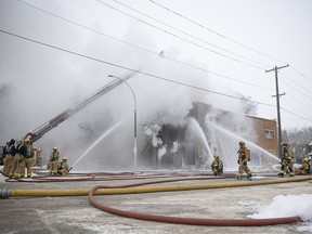 Fire crews battle a blaze on the corner of Halifax street and 12th avenue on Thursday, January 13, 2022 in Regina.