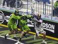 San Diego Seals forward Wesley Berg runs the ball under pressure from Saskatchewan Rush defenders Jeff Cornwall and Tristan Rai during first-quarter NLL action on Friday.