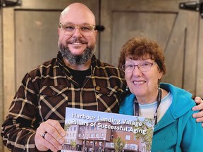 Harbour Landing Village has developed its own version of the “Pillars of Successful Aging” to help Regina and area seniors to live life to the fullest. Harbour Landing Village President and CEO Janson Anderson (left) and resident Florence Cattell proudly display the 2022 Pillars of Successful Aging calendar for 2022. Free copies of the informative calendar are available by contacting Harbour Landing Village at 306-559-5545. (Harbour Landing Village is fully compliant with the Public Health Order for masking. Photo was taken in the resident dining area where masking is not required at the table. Both participants have been fully vaccinated and tested negative prior to the photo shoot) SUPPLIED