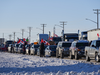 The Freedom Convoy 2022 is cheered on by supporters parked west of Winnipeg in this Tuesday photo.