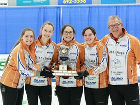 Moose Jaw's Penny Barker team poses with coach Mark Lang after winning the provincial Scotties Tournament of Hearts on Jan. 9, 2022 in Assiniboia. Left to right are: Penny Barker, third Christie Gamble, second Jenna Enge and lead Danielle Sicinski. HALI BOOTH/EXPESSIONS PHOTOGRAPHY