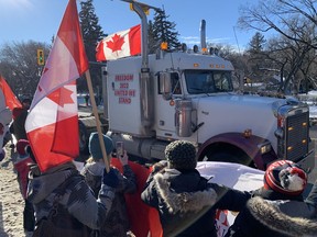 People rally in support of truckers opposed to vaccine mandates at Saskatchewan Legislative Building in Regina, on Sat. Jan. 29, 2022.