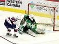 The Regina Pats' Connor Bedard scores a goal against the Prince Albert Raiders' Tikhon Chaika on Tuesday at the Brandt Centre.