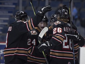 The Calgary Hitmen, shown celebrating a first-period goal at the Brandt Centre on Tuesday, emerged with a 4-3 shootout loss to the Regina Pats.
