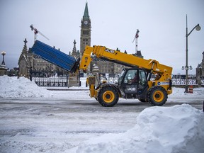 Police from all across Canada were still in the area of the downtown protest Sunday, along with city workers getting Parliament Hill back to normal, February 20, 2022.
