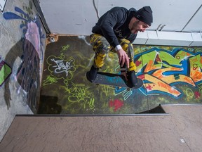 Andrew Hincks, skateboard instructor and owner of 306 SHOP in Regina, flies over a quarter pipe ramp in the store's indoor skatepark in 2018.
