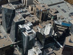 An aerial photo shows Regina's downtown, including the Hill Towers.