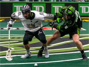 Saskatchewan Rush D-man Mike Messanger gets tangled up with an opponent during National Lacrosse League action at Sasktel Centre in Saskatoon on Saturday, December 11, 2021.