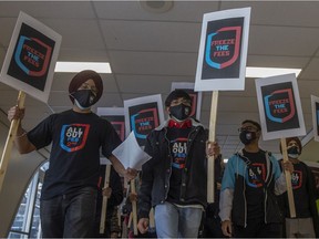 Students and supporters march through the University of Regina for the "Freeze The Fees" campaign, calling on the provincial government and the University of Regina to freeze all international and domestic student fees.