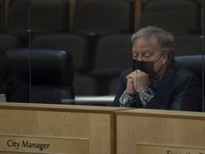 Regina City Manager Jim Nicol listens to calls from the public during a city council meeting at City Hall on Friday, February 11, 2022 in Regina.