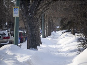 A snowy sidewalk is seen in a residential Regina neighbourhood on Wednesday, Feb. 16.